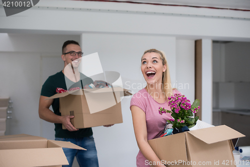 Image of young couple moving into a new home