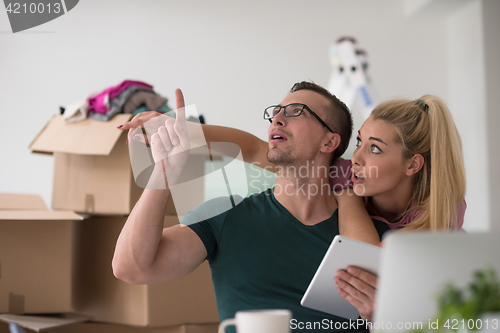 Image of Young couple moving in a new home