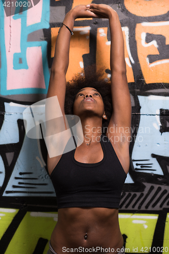 Image of black woman after a workout at the gym