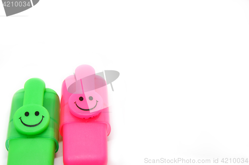 Image of Green and red marker with smile face