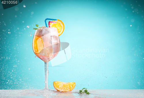 Image of The rose exotic cocktail and fruit on blue