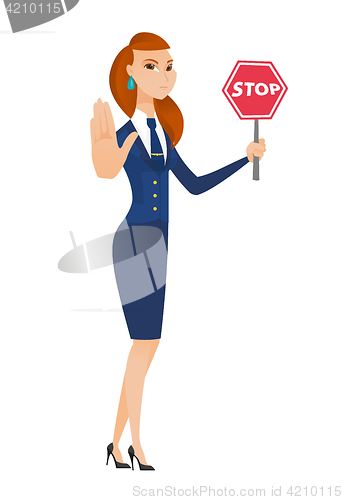 Image of Caucasian stewardess holding stop road sign.