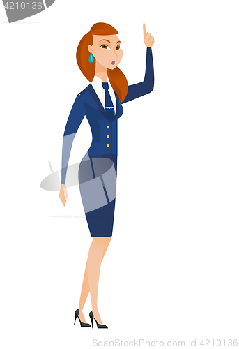 Image of Stewardess with open mouth pointing finger up.