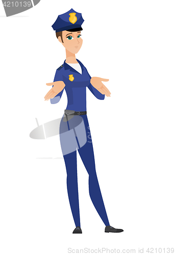 Image of Caucasian confused policewoman shrugging shoulders