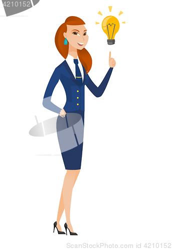 Image of Stewardess pointing at bright idea light bulb.