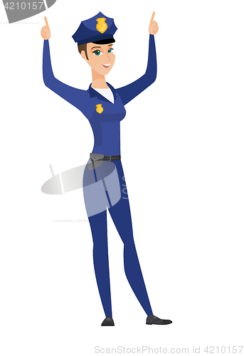 Image of Policewoman standing with raised arms up.