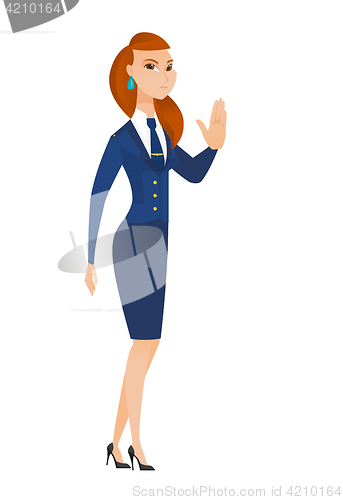 Image of Caucasian stewardess showing stop hand gesture.