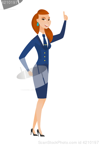 Image of Caucasian stewardess pointing with her forefinger