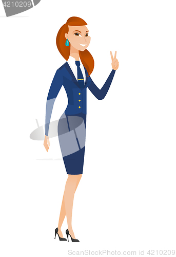 Image of Caucasian stewardess showing the victory gesture.