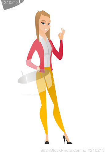 Image of Smiling business woman showing ok sign.