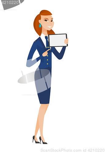 Image of Smiling stewardess holding tablet computer.