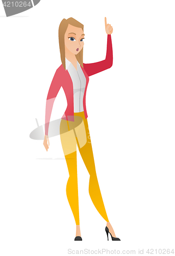 Image of Business woman with open mouth pointing finger up.