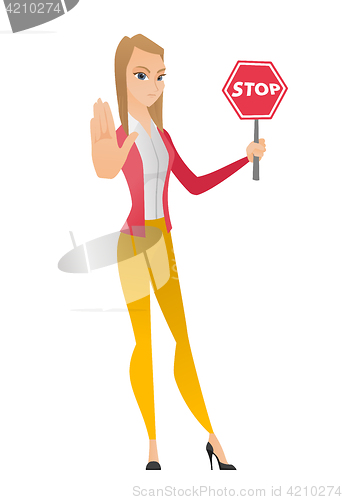 Image of Caucasian business woman holding stop road sign.