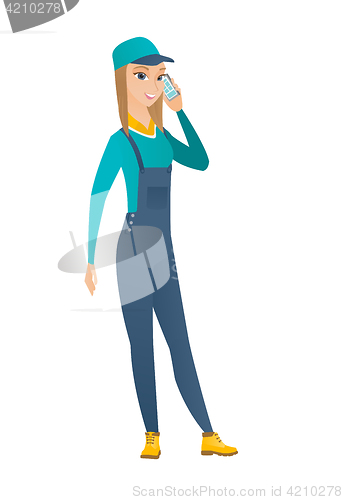 Image of Mechanic talking on a mobile phone.