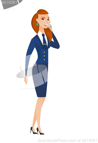 Image of Stewardess talking on a mobile phone.