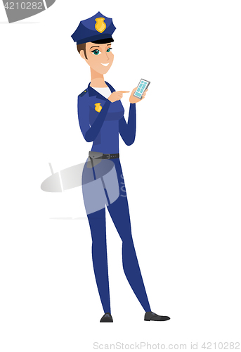 Image of Caucasian policewoman holding a mobile phone.