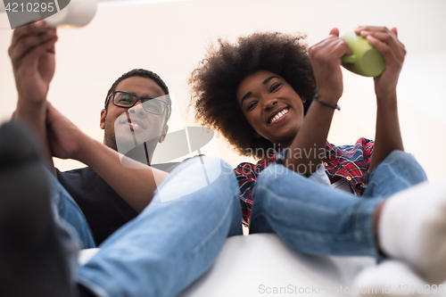 Image of couple having break during moving to new house