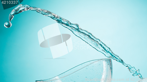 Image of The water splashing to glass bowl on white background