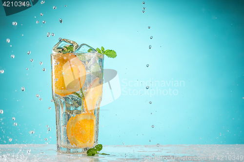 Image of The rose exotic cocktail and fruit on blue