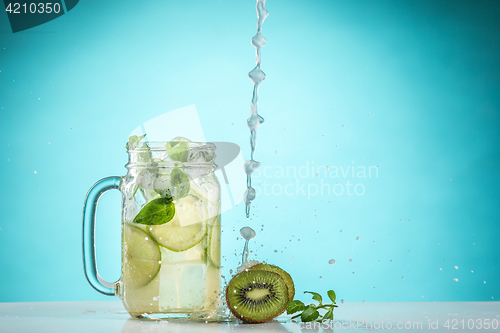 Image of The rose exotic cocktail and fruit on blue