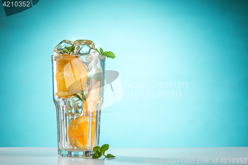 Image of The rose exotic cocktail and fruit on blue