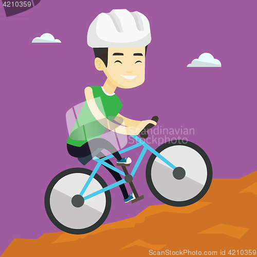 Image of Young man on bicycle traveling in the mountains.