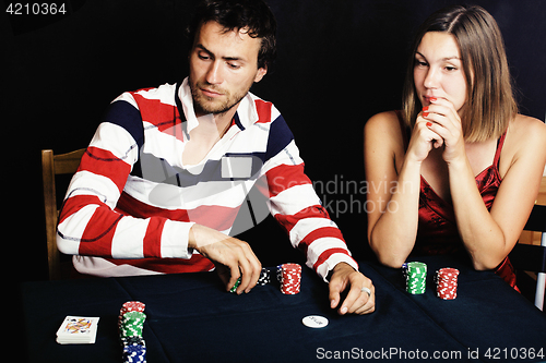 Image of young people playing poker off-line tournament, friends party concept at home 