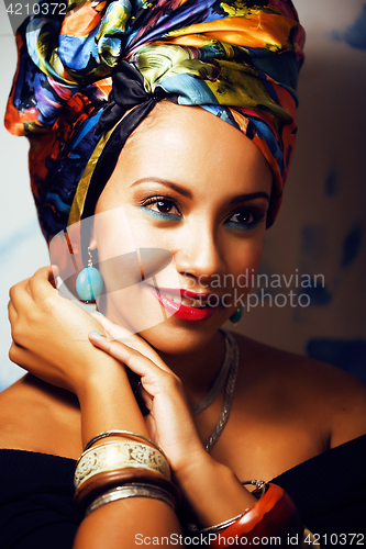 Image of beauty bright african woman with creative make up, shawl on head