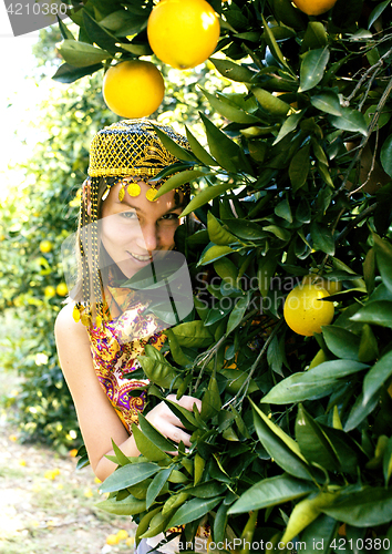 Image of pretty islam woman in orange grove smiling, real muslim girl che