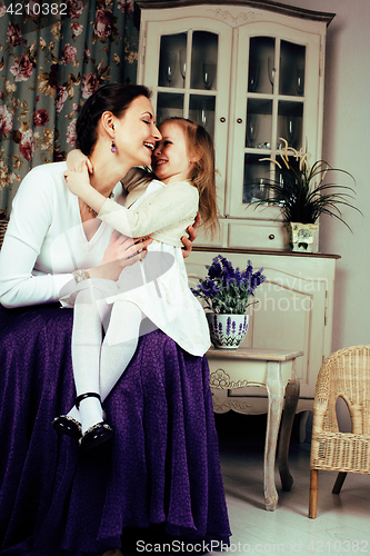 Image of young mother with daughter at luxury home interior vintage