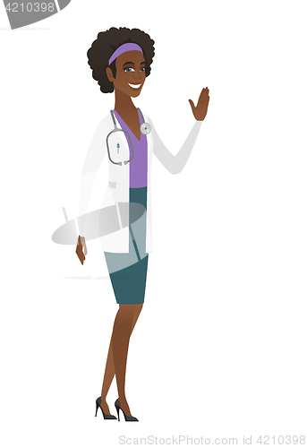 Image of Young african-american doctor waving her hand.