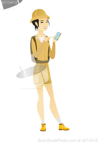 Image of Asian traveler holding a mobile phone.