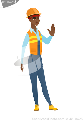 Image of African-american builder showing stop hand gesture
