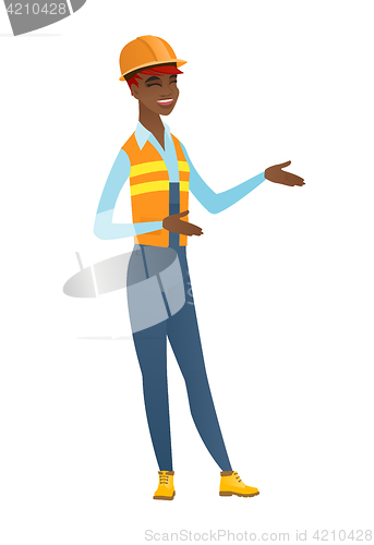 Image of Young african-american happy builder gesturing.