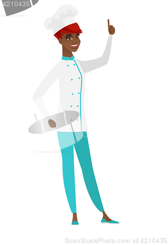 Image of African chef cook pointing with her forefinger.