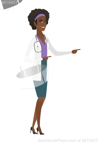 Image of Young african-american doctor pointing to the side