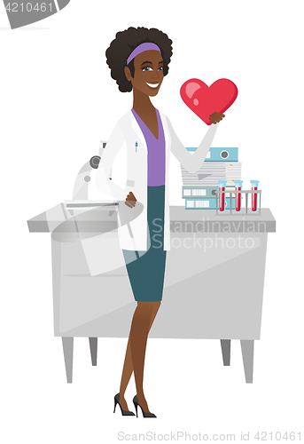Image of African-american doctor holding a big red heart.