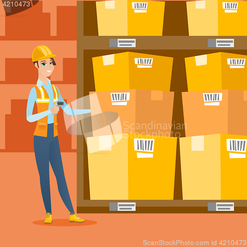 Image of Warehouse worker scanning barcode on box.