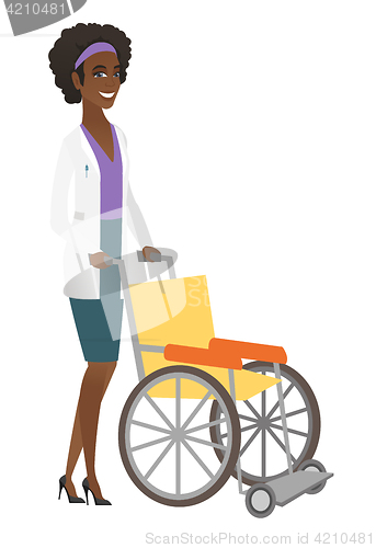 Image of African-american doctor pushing empty wheelchair.