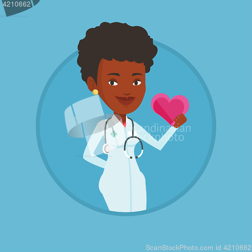 Image of Doctor cardiologist holding heart.