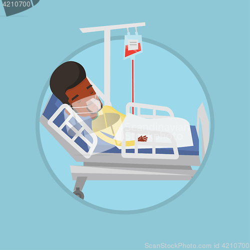 Image of Patient lying in hospital bed with oxygen mask.