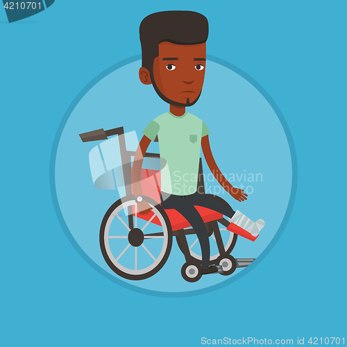 Image of Man with broken leg sitting in wheelchair.