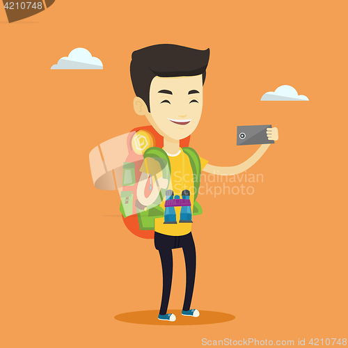 Image of Man with backpack making selfie.