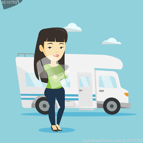 Image of Woman standing in front of motor home.