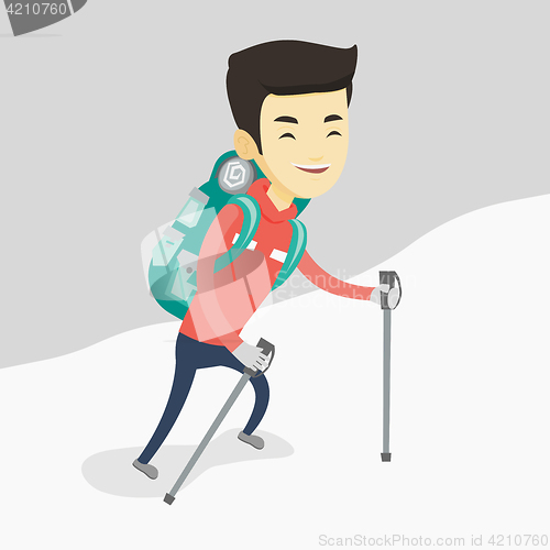 Image of Young mountaneer climbing a snowy ridge.