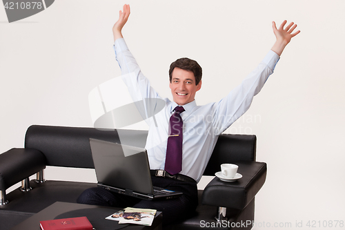 Image of Young Emotional Man In A Business Suit