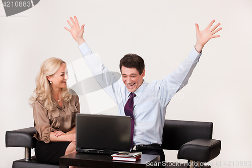 Image of Young Woman And Man with a notebook