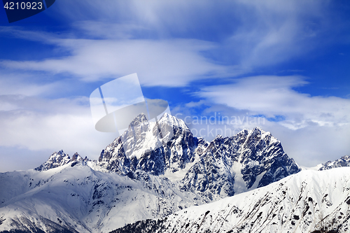 Image of Snow mountains and blue sky with clouds in winter