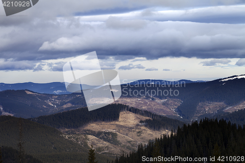 Image of Mountains and sky with clouds in evening