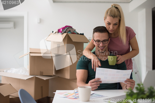 Image of Young couple moving in a new home